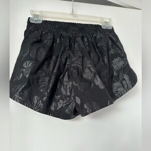 Black Athleta shorts with leaf print